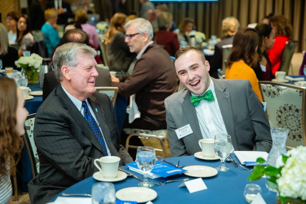 Benjamin Parsell laughing with President Haas at Scholarship Dinner 2019